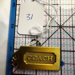 Coach Gold Tag